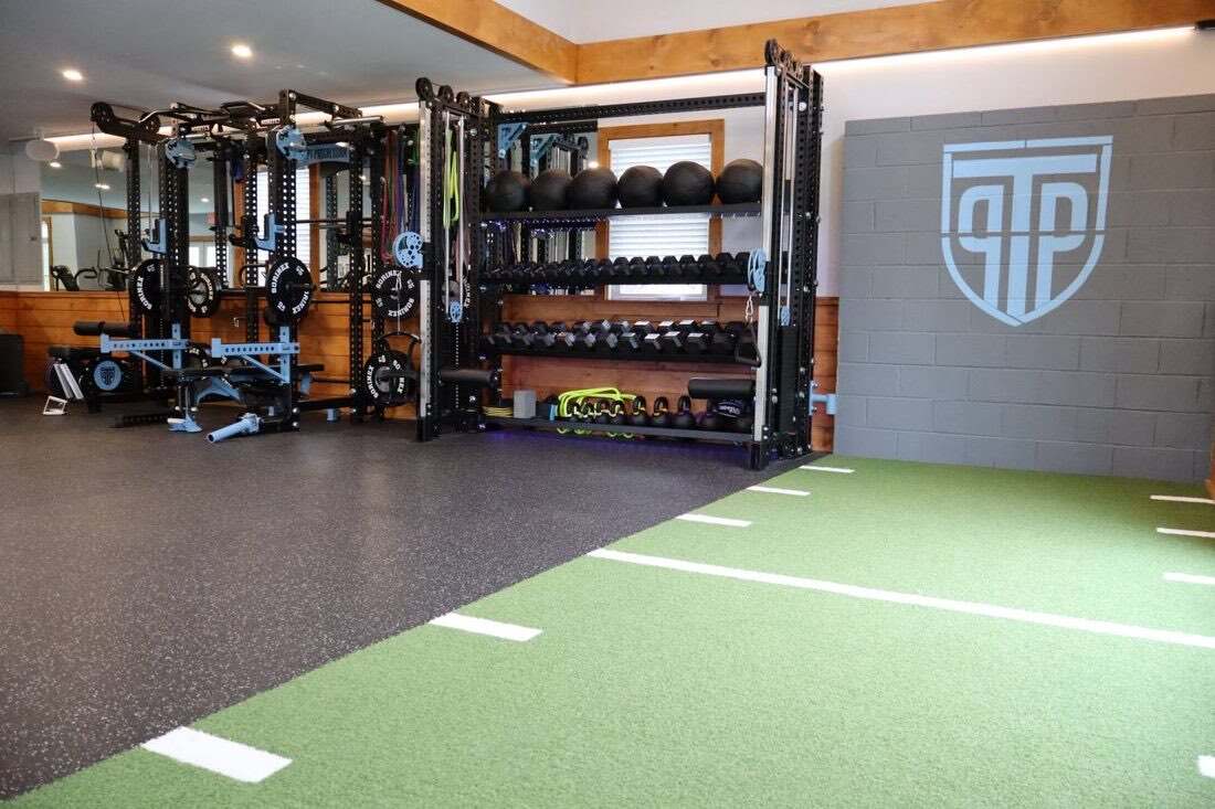 The turf training strip at PT Progression used for balance, agility, and return-to-sport work